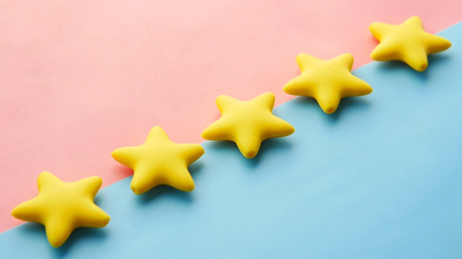 A row of yellow stars on a colorful background