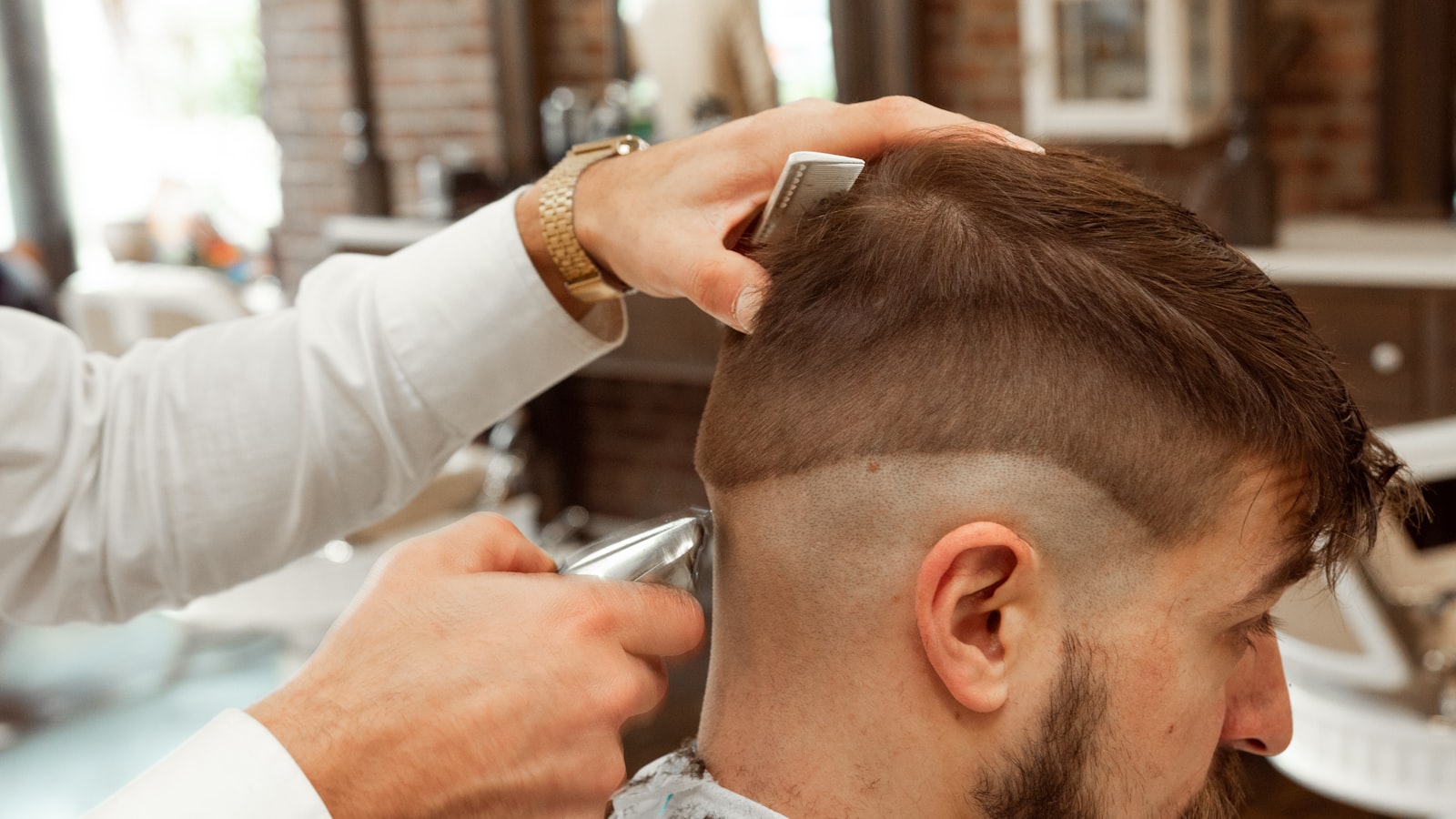 A hairdresser cutting a client's hair
