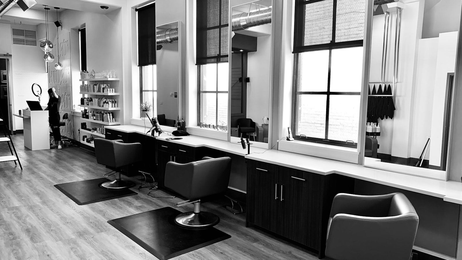 An empty salon chair waiting in soft window light